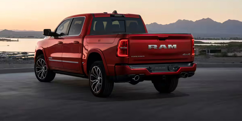2026 Red RAM 1500 parked rive side in its back side profile