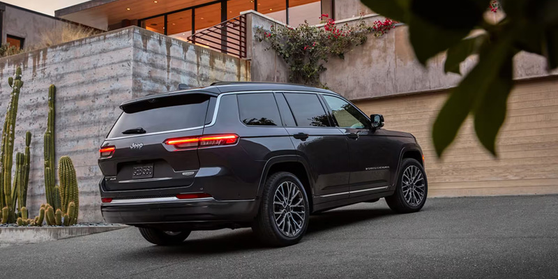 2026 Jeep Grand Cherokee L parked in front of house in its stunning back profile look