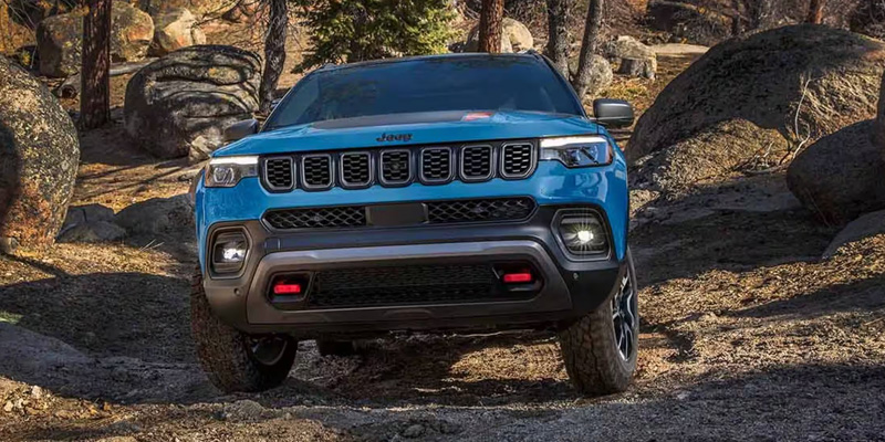 2026 Jeep Compass showing its off-roading capabilities in mountains terrains